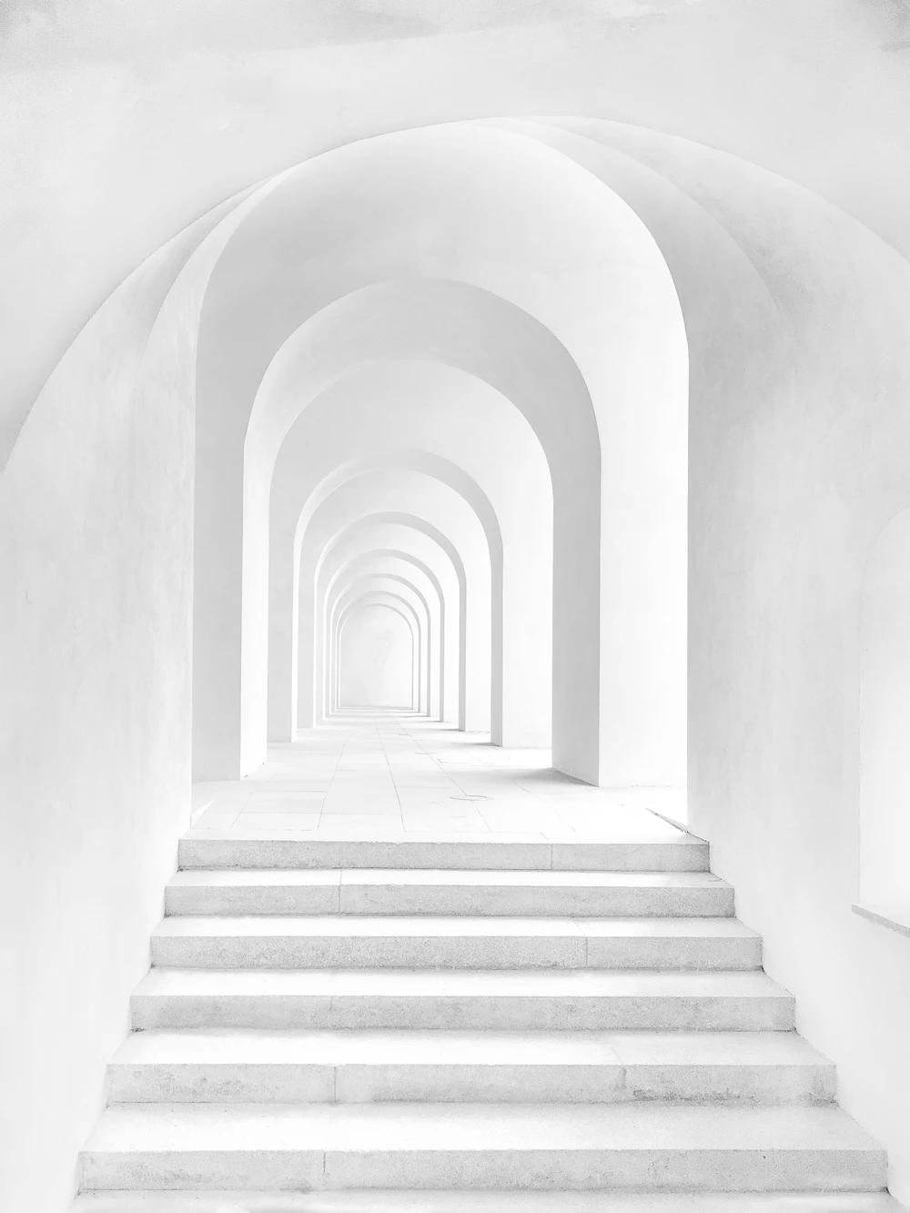 Placeholder photograph of a vaulted white corridor