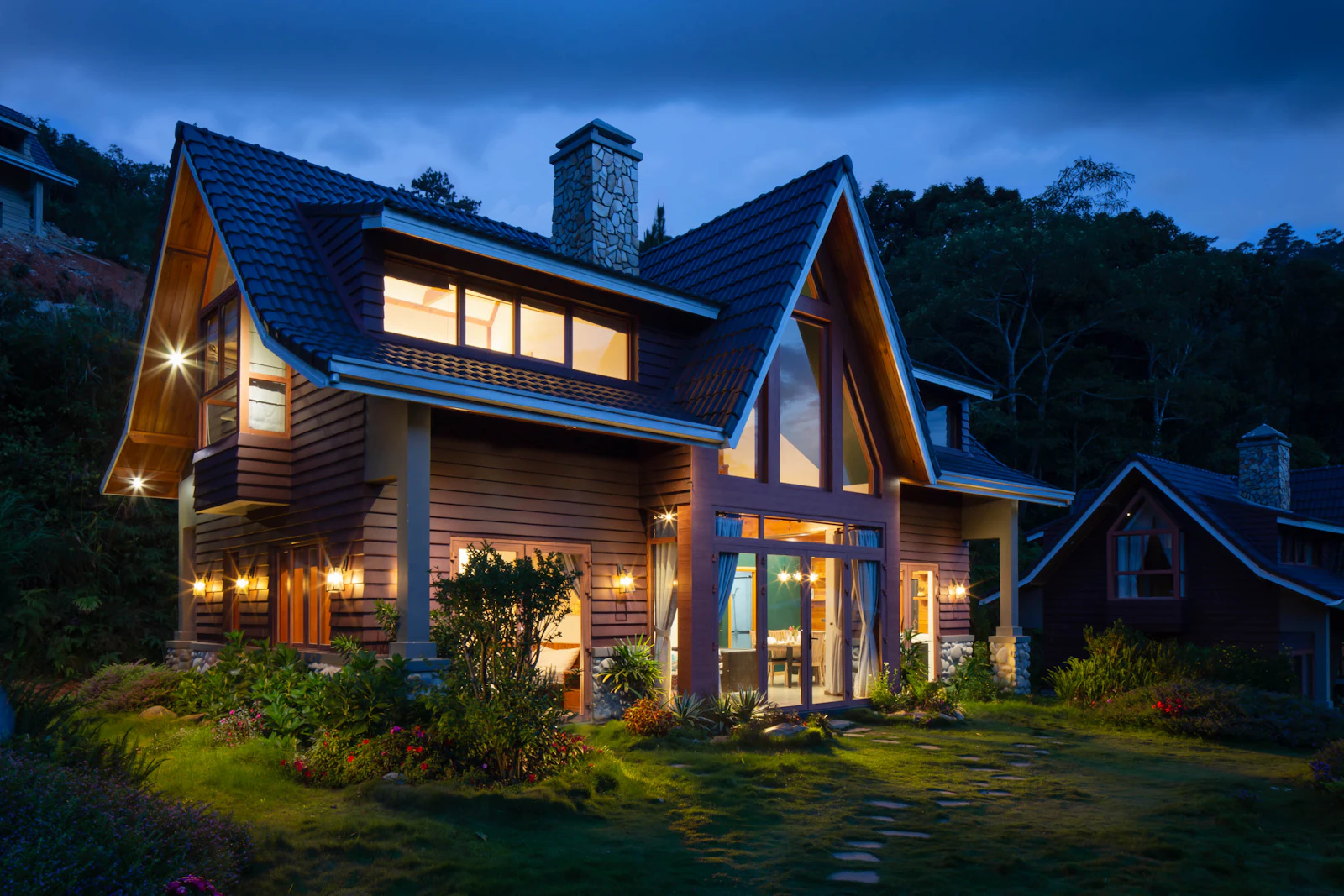Placeholder photograph of a timber house at dusk