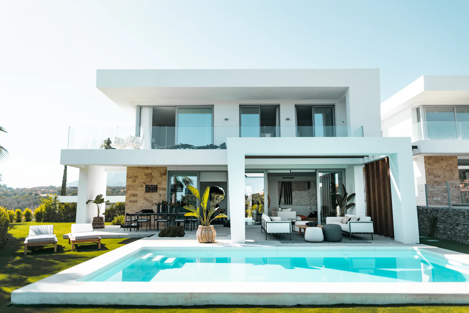Placeholder photograph of a modern villa with a pool